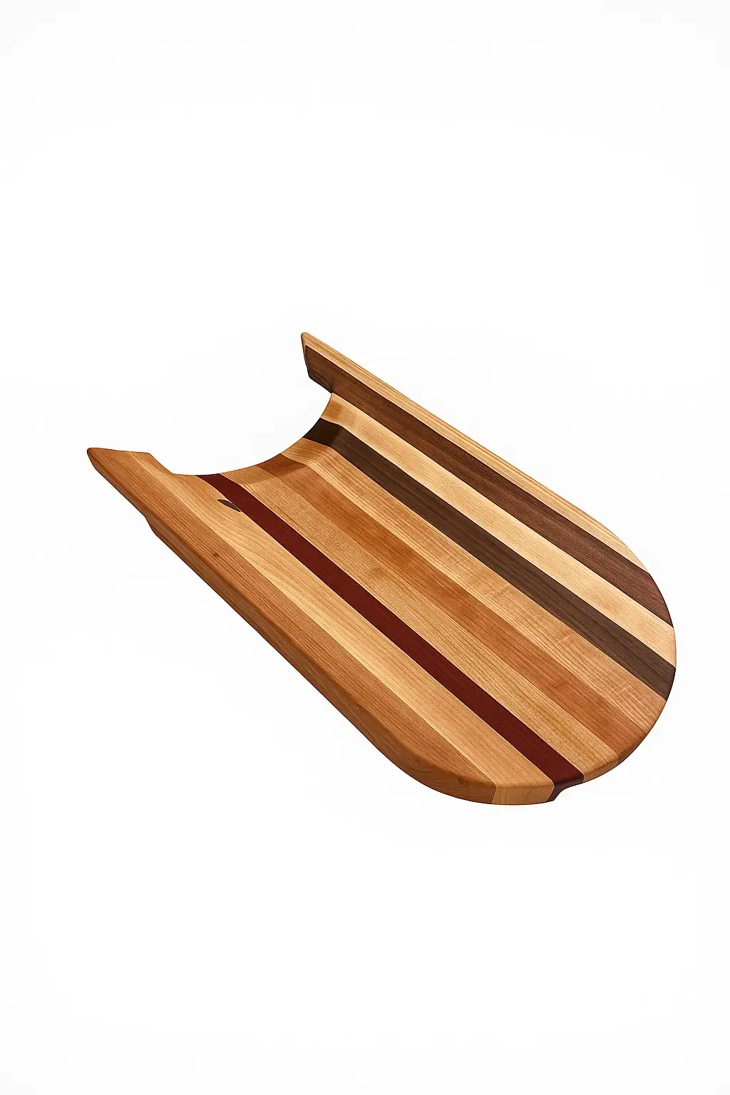 Sled-style cutting board made from Maple, Cherry, Bloodwood, and Mahogany hardwoods, displayed on a white background at an angled view