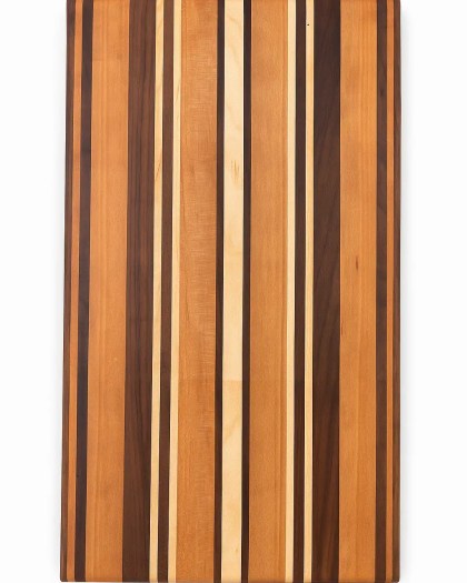 Long-grain Maple, Cherry, and Black Walnut cutting board handcrafted by Carvers Creek, featuring alternating natural hardwood stripes.